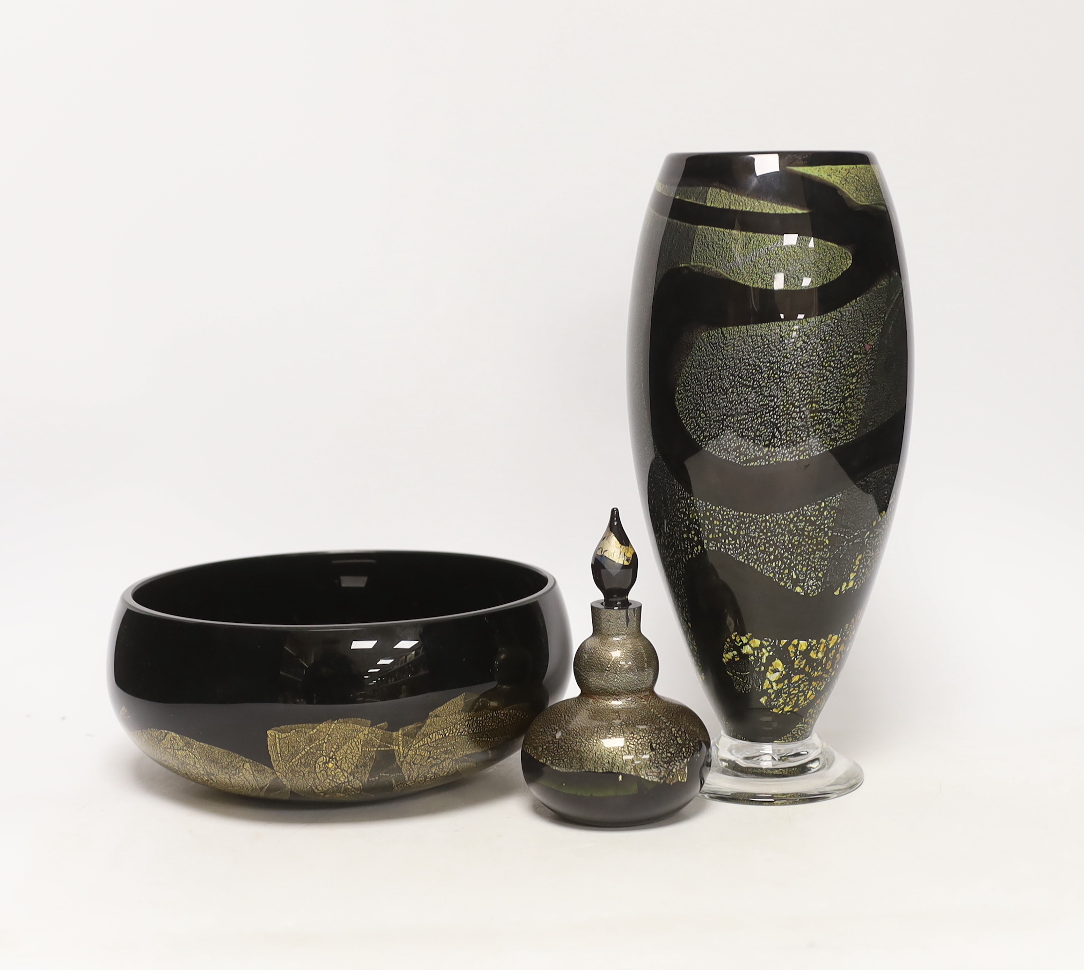 Three Isle of Wight glass pieces with gold flecked design, comprising vase, centre bowl and scent bottle with stopper, largest 27cm high
